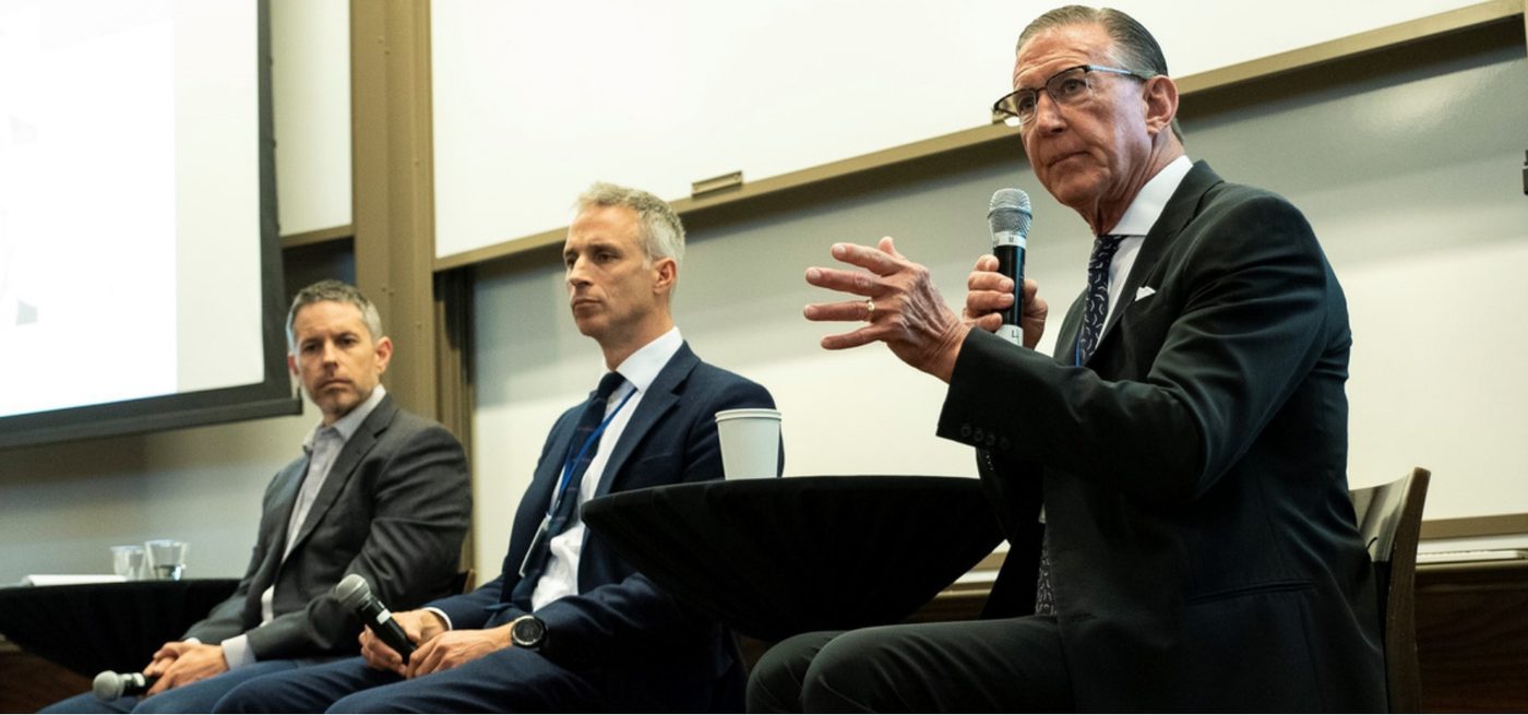 Panel discussion on stage at a TFOA Symposium